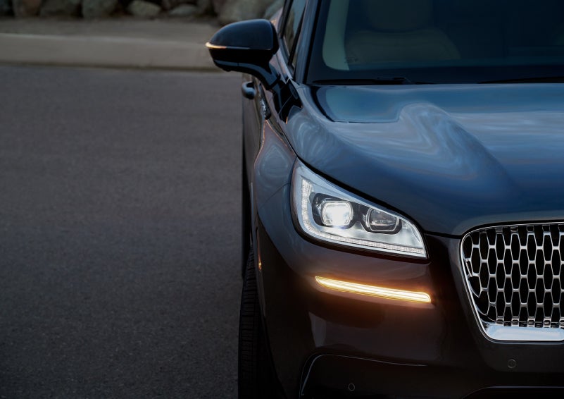 The turn signal on the front fascia is a bold sunset orange stroke of brilliance against a Flight Blue exterior | Mark Ficken Lincoln in Charlotte NC