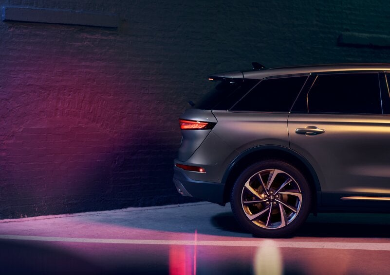A dramatization of a 2025 Lincoln Corsair® SUV is shown backing up toward a wall. | Mark Ficken Lincoln in Charlotte NC