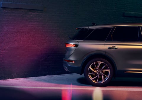 A dramatization of a 2025 Lincoln Corsair® SUV is shown backing up toward a wall. | Mark Ficken Lincoln in Charlotte NC