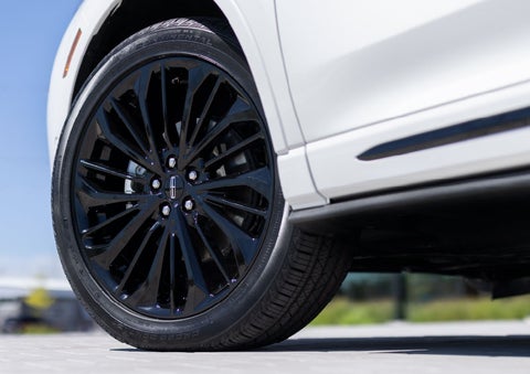 A stylish 20-inch black aluminum wheel of the available Jet Appearance Package is shown. | Mark Ficken Lincoln in Charlotte NC