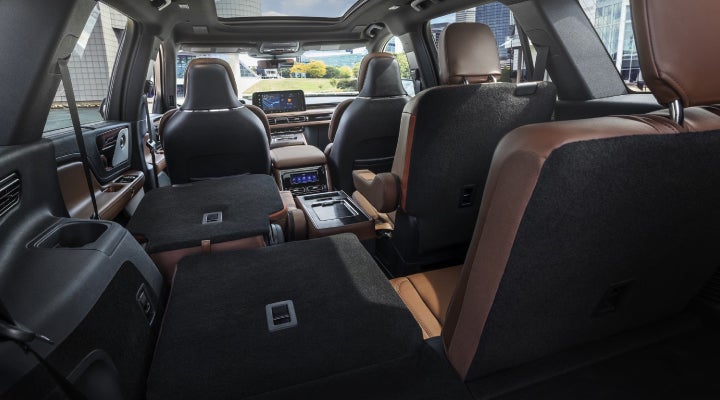 One side of the PowerFold® third-row seat and a second-row seat are folded forward in the 2026 Lincoln Aviator® SUV. | Mark Ficken Lincoln in Charlotte NC