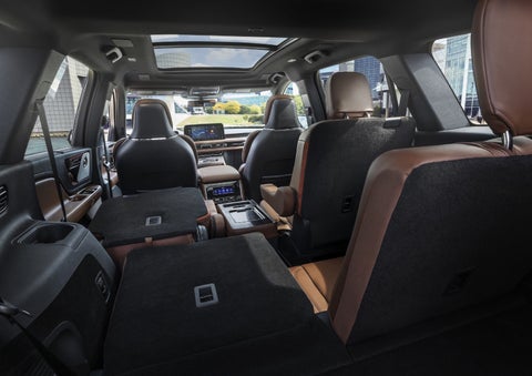 One side of the PowerFold® third-row seat and a second-row seat are folded forward in the 2026 Lincoln Aviator® SUV. | Mark Ficken Lincoln in Charlotte NC