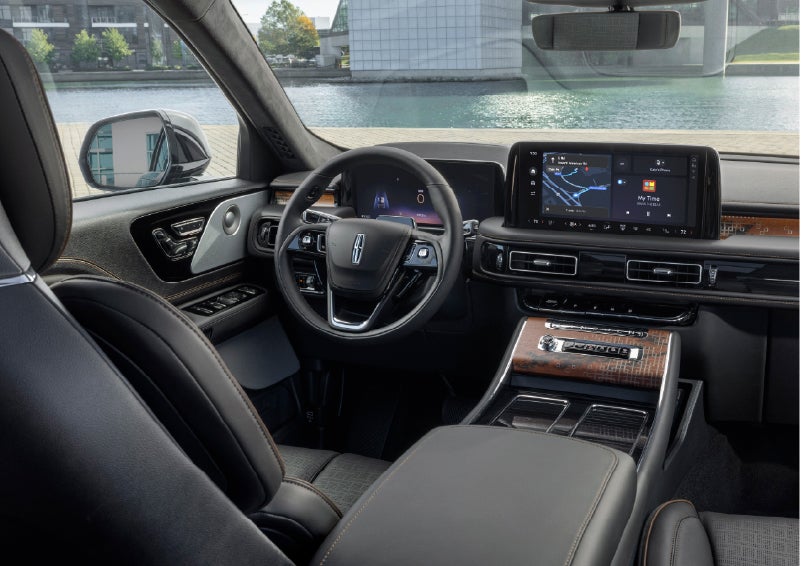The interior of the 2026 Lincoln Aviator® SUV is shown parked with a view of a harbor through the windshield. | Mark Ficken Lincoln in Charlotte NC
