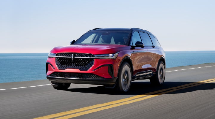 A 2026 Lincoln Nautilus® SUV is being driven on a seaside roadway. | Mark Ficken Lincoln in Charlotte NC