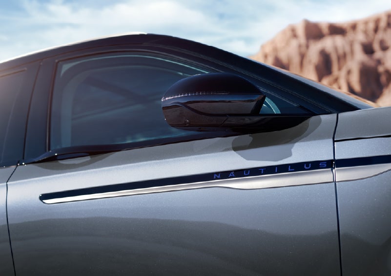 Blue lettering on the side of the vehicle that reads Nautilus indicates the available Hybrid Powertrain. | Mark Ficken Lincoln in Charlotte NC