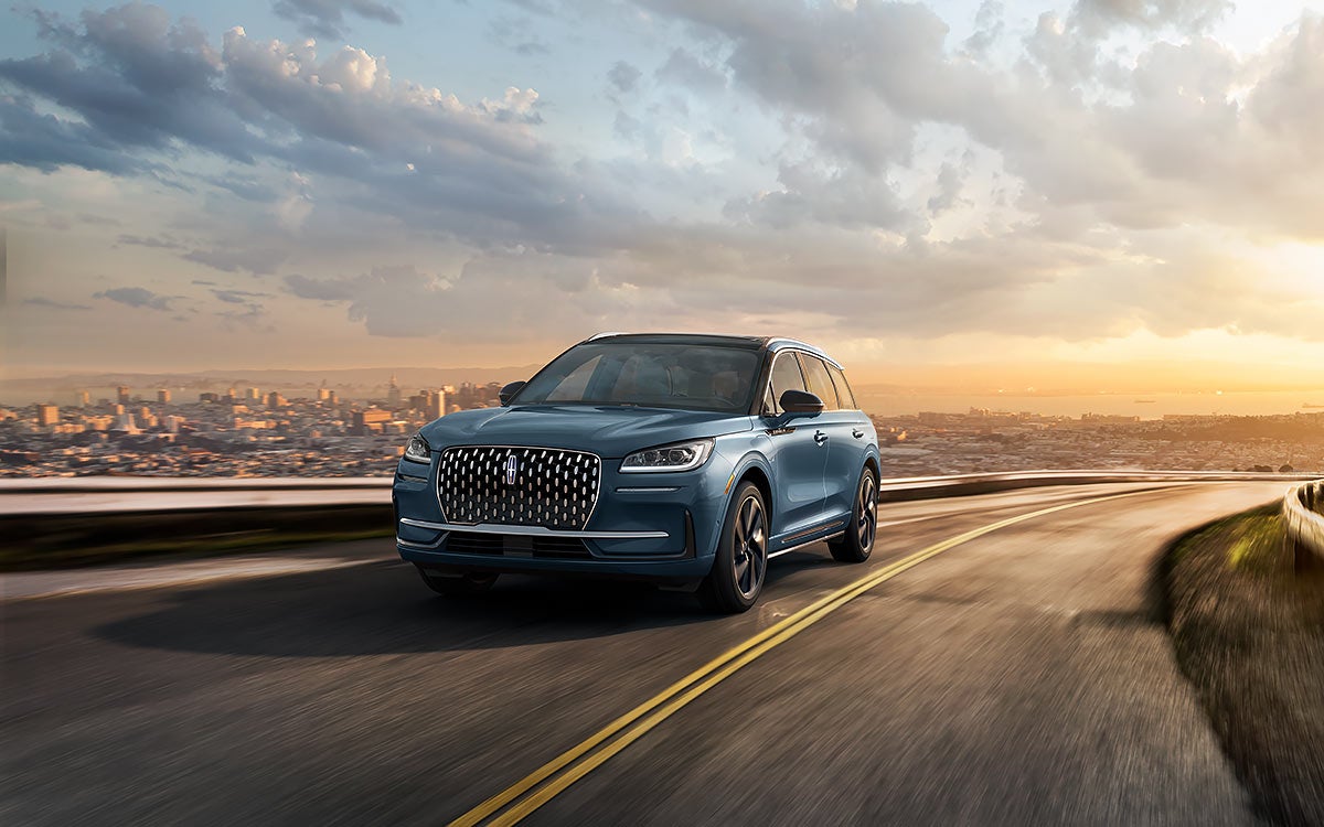 The Lincoln Corsair® SUV driving down a road